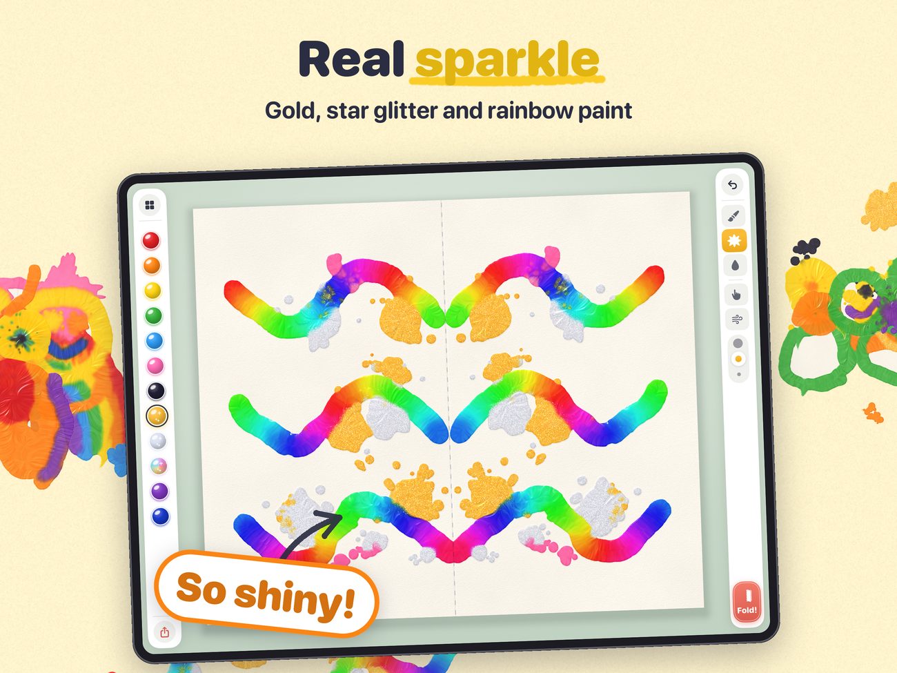 A glittery print with gold and star glitter and rainbow paint.