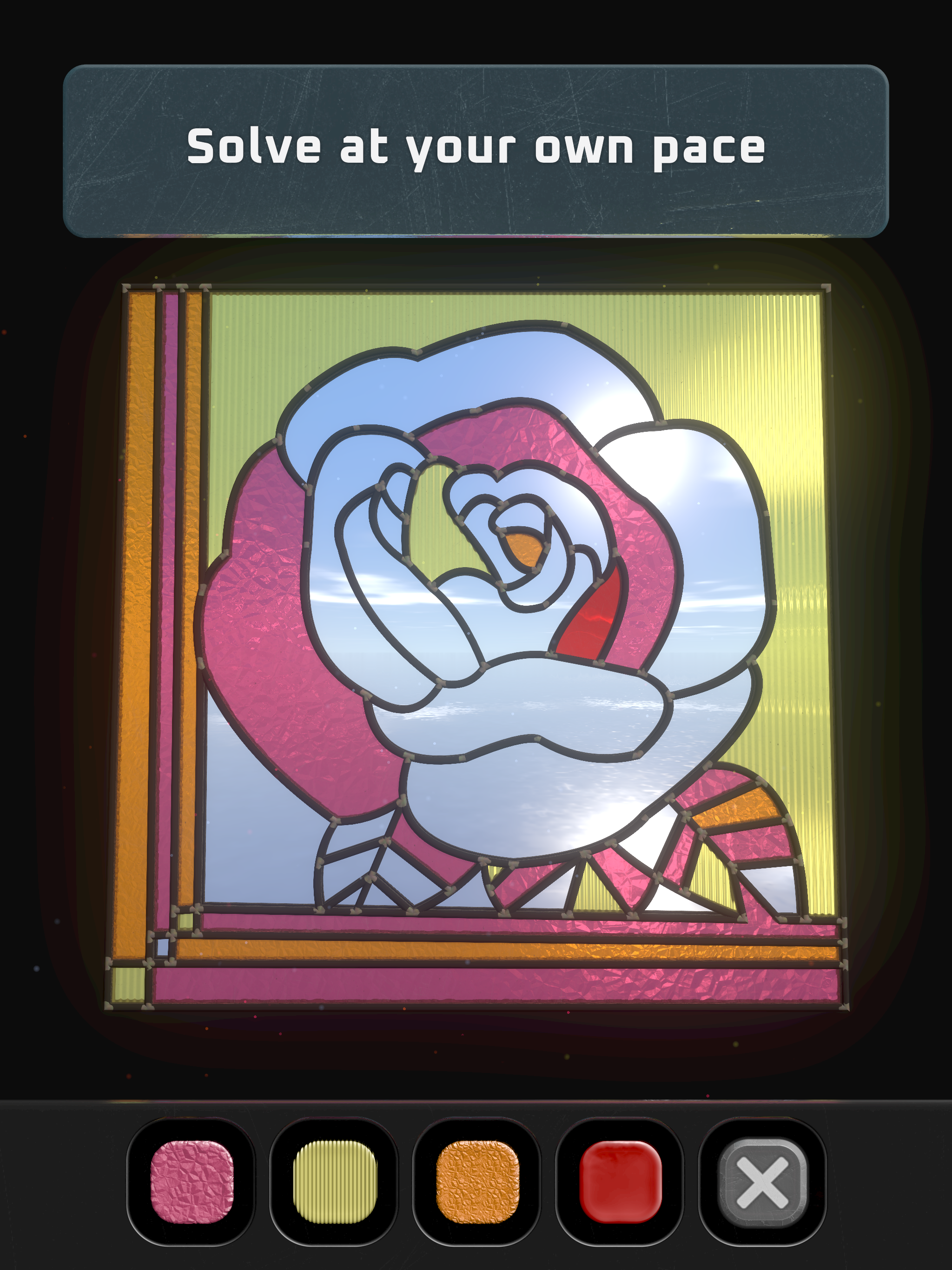 Glass on iPad, showing a colourful stained-glass flower puzzle.